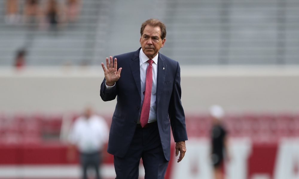 Nick Saban walks the field ahead of Utah State