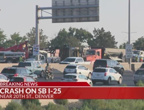 Traffic backs up on I-25 after construction equipment crash