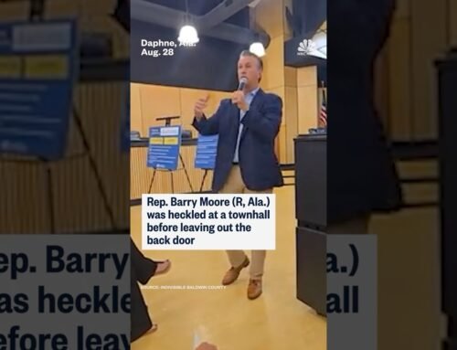 Rep. Barry Moore (R, Ala.) was heckled at a townhall before leaving out the back door