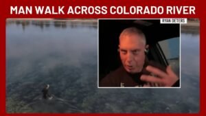 The Colorado River’s water level is so low that a man can walk across it