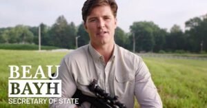 Bayh touts Marines service in 1st ad for secretary of state