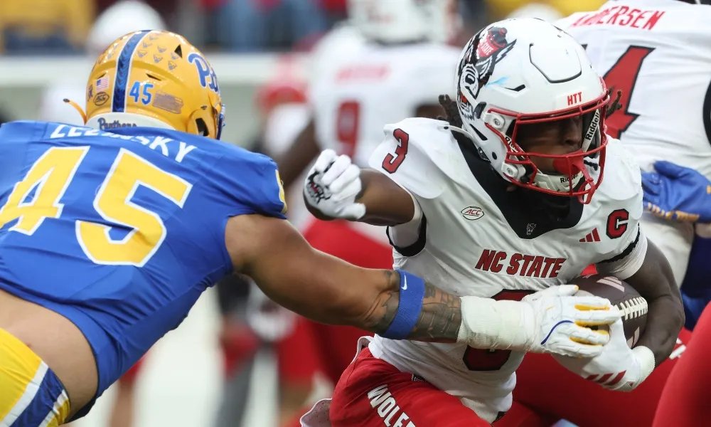 NC State running back Hollywood Smothers breaks a tackle against Pitt
