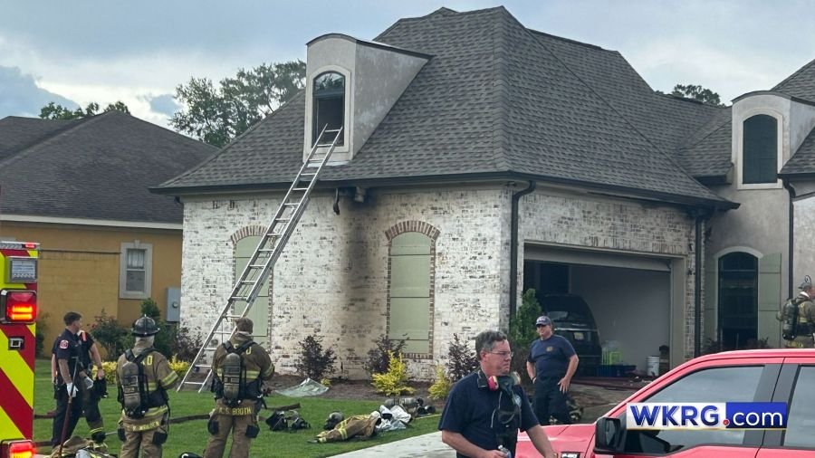 Firefighters respond to a house fire on Heron Lakes Circle in Mobile, Alabama