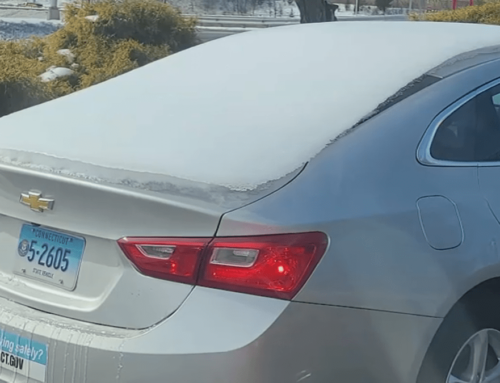 State vehicle seen covered in snow and ice traveling on Connecticut r…