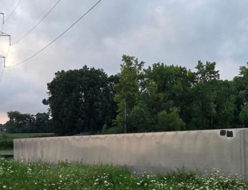 Semi-trailer overturns in pond alongside Indiana Toll Road