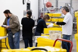 Judge extends pause on ‘unconstitutional’ Trump order, postal rule li…